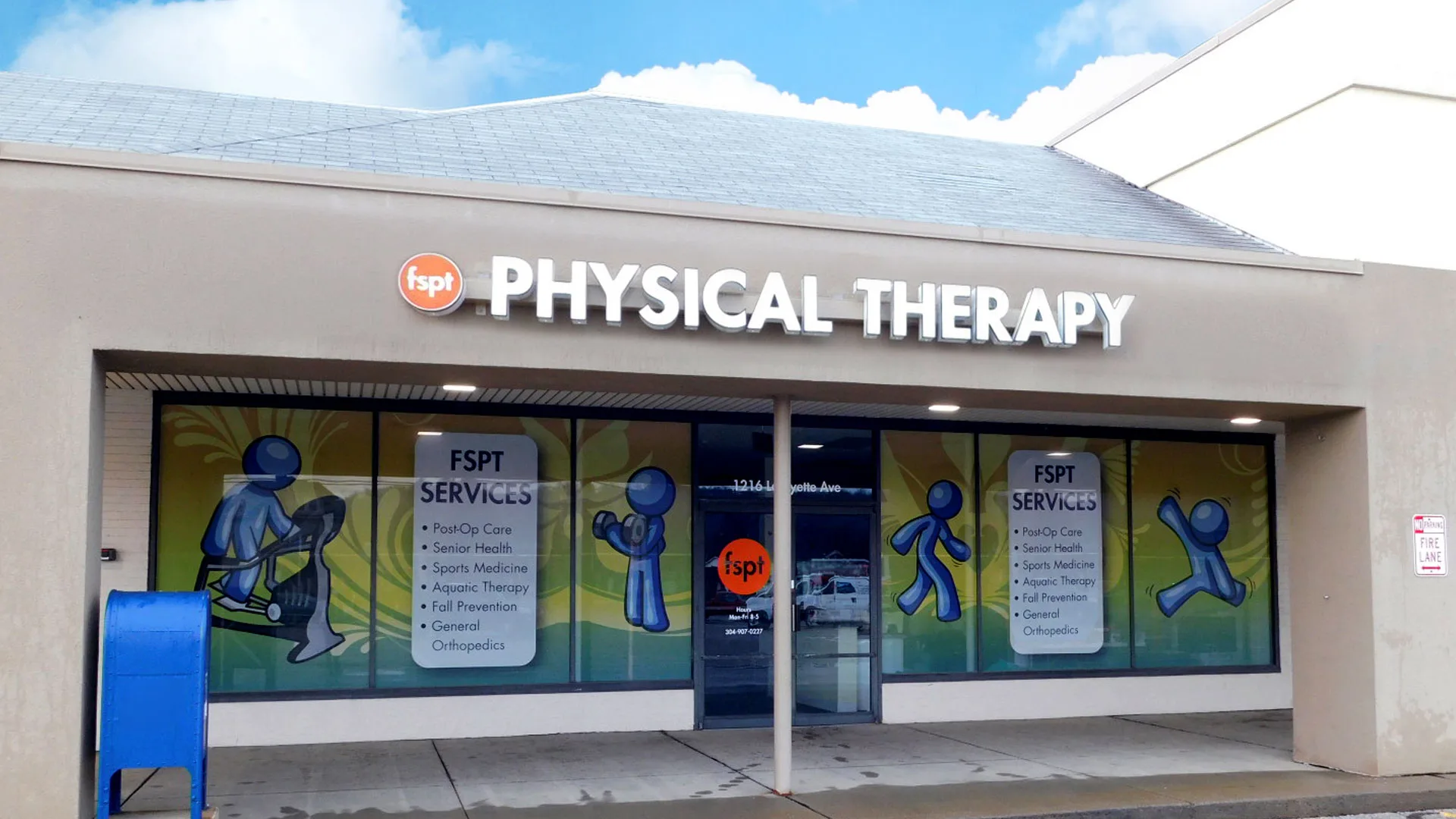 Light-coloured storefront with a Physical Therapy sign and window decals illustrating the services provided